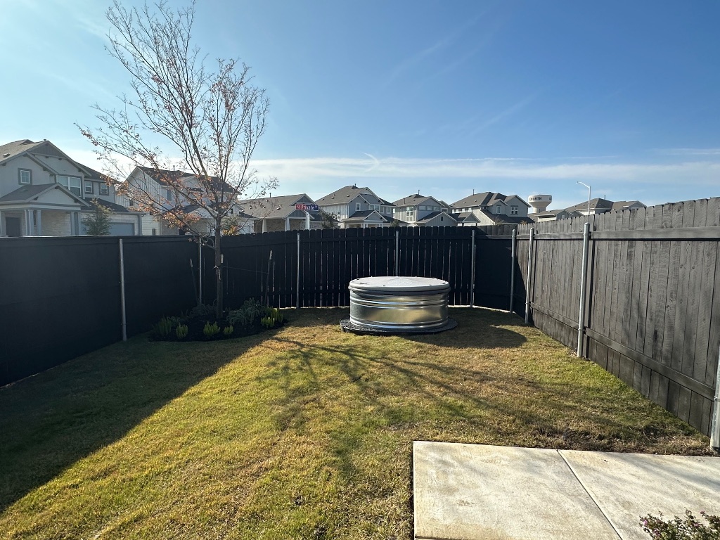 372 Glocken Lane Kyle, TX 78640 - Photo 30 of 37 a view of a backyard with wooden fence