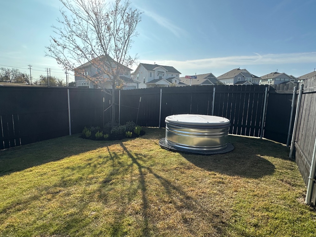 372 Glocken Lane Kyle, TX 78640 - Photo 31 of 37 a view of a backyard with wooden fence