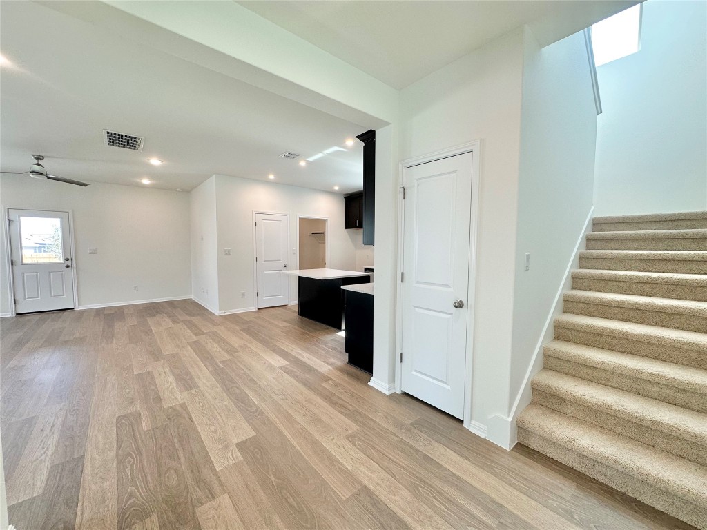 372 Glocken Lane Kyle, TX 78640 - Photo 5 of 37 a view of a kitchen with wooden floor and a sink