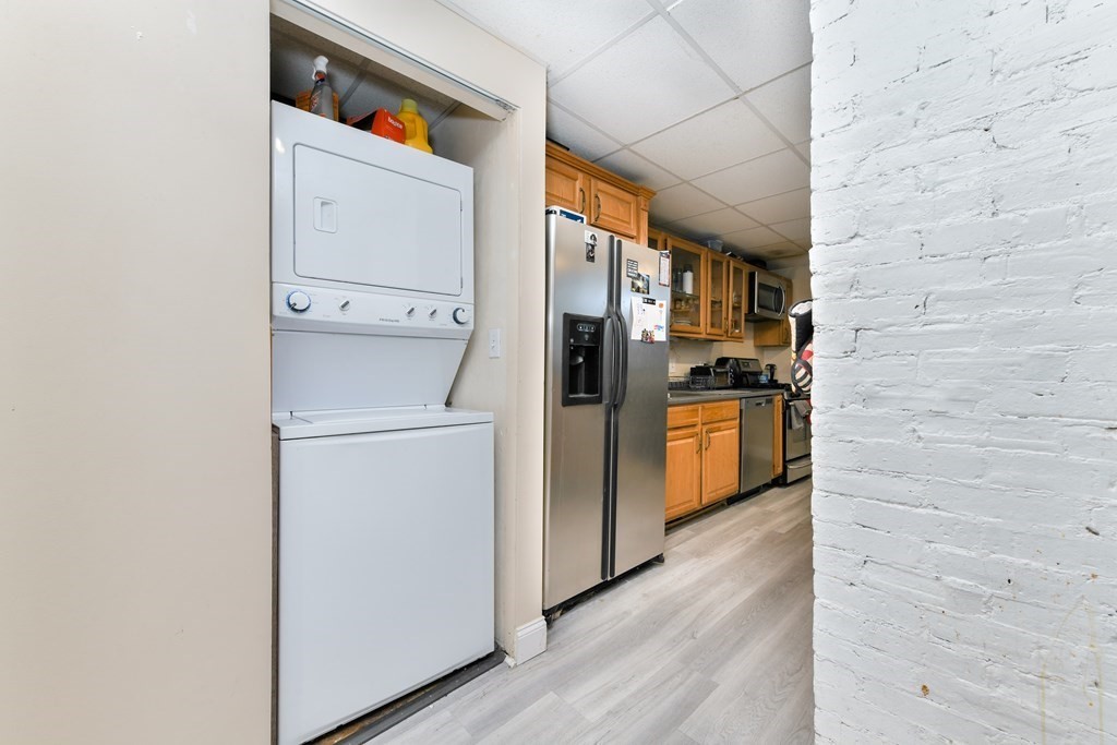 748 East 3rd Street, Unit A Boston, MA 02127 - Photo 4 of 16 a kitchen with stainless steel appliances a refrigerator and a stove