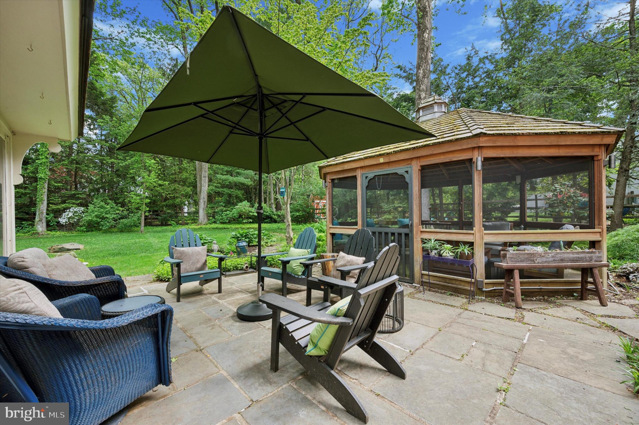 949 Leopard Road Jenkintown, PA 19046 - Photo 57 of 88 a view of a patio with couches chairs and a umbrella