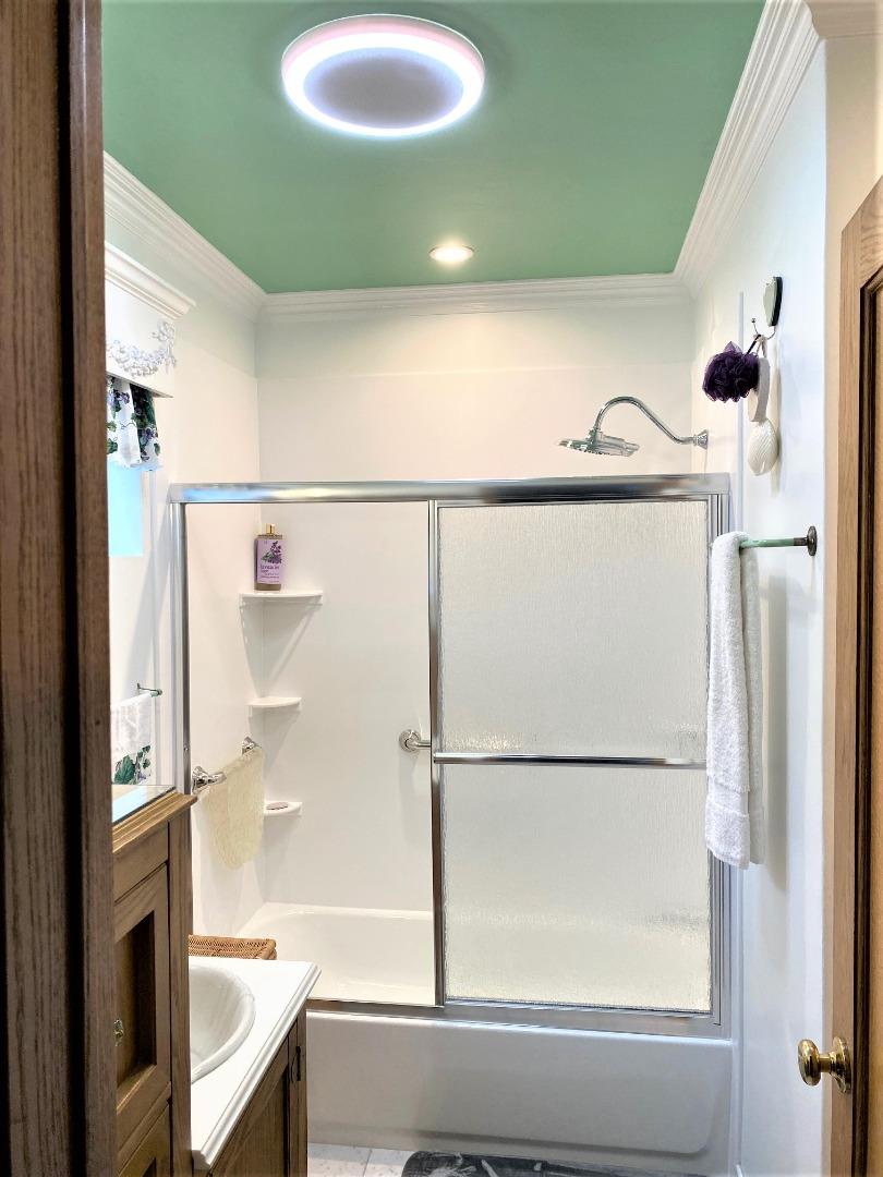 621 McClellan Avenue, Unit STUDIO Monterey, CA 93940 - Photo 21 of 32 a bathroom with a sink and a mirror