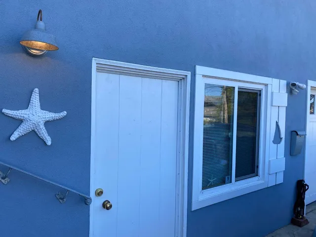 a view of a livingroom with a chandelier fan