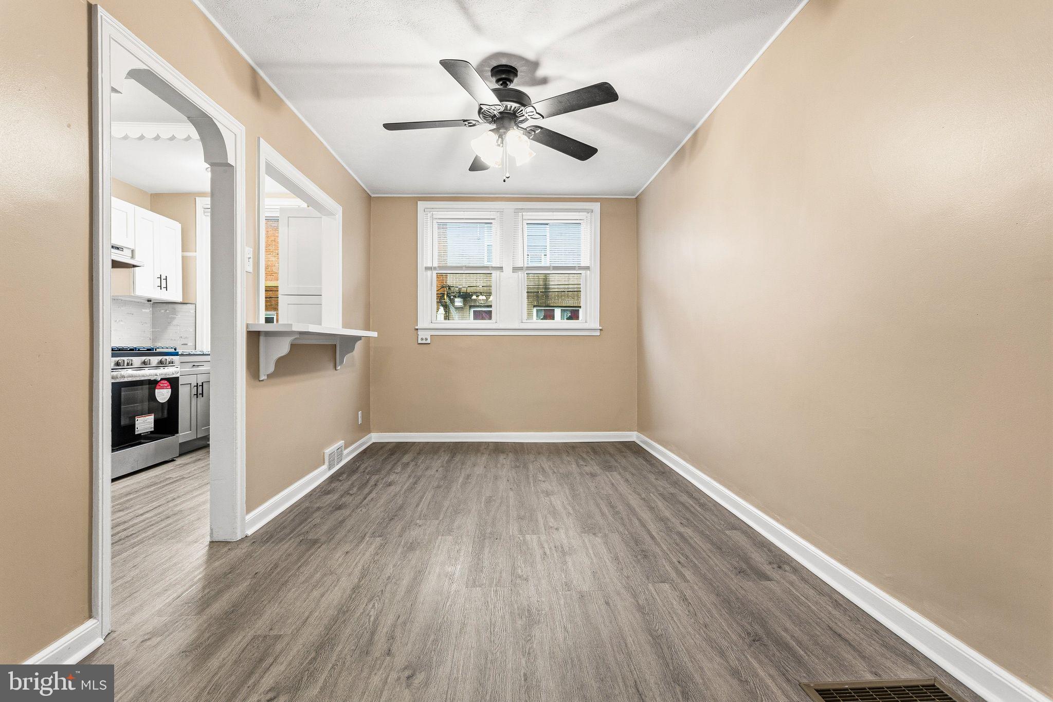 4528 Tudor Street Philadelphia, PA 19136 - Photo 3 of 21 an empty room with wooden floor and windows