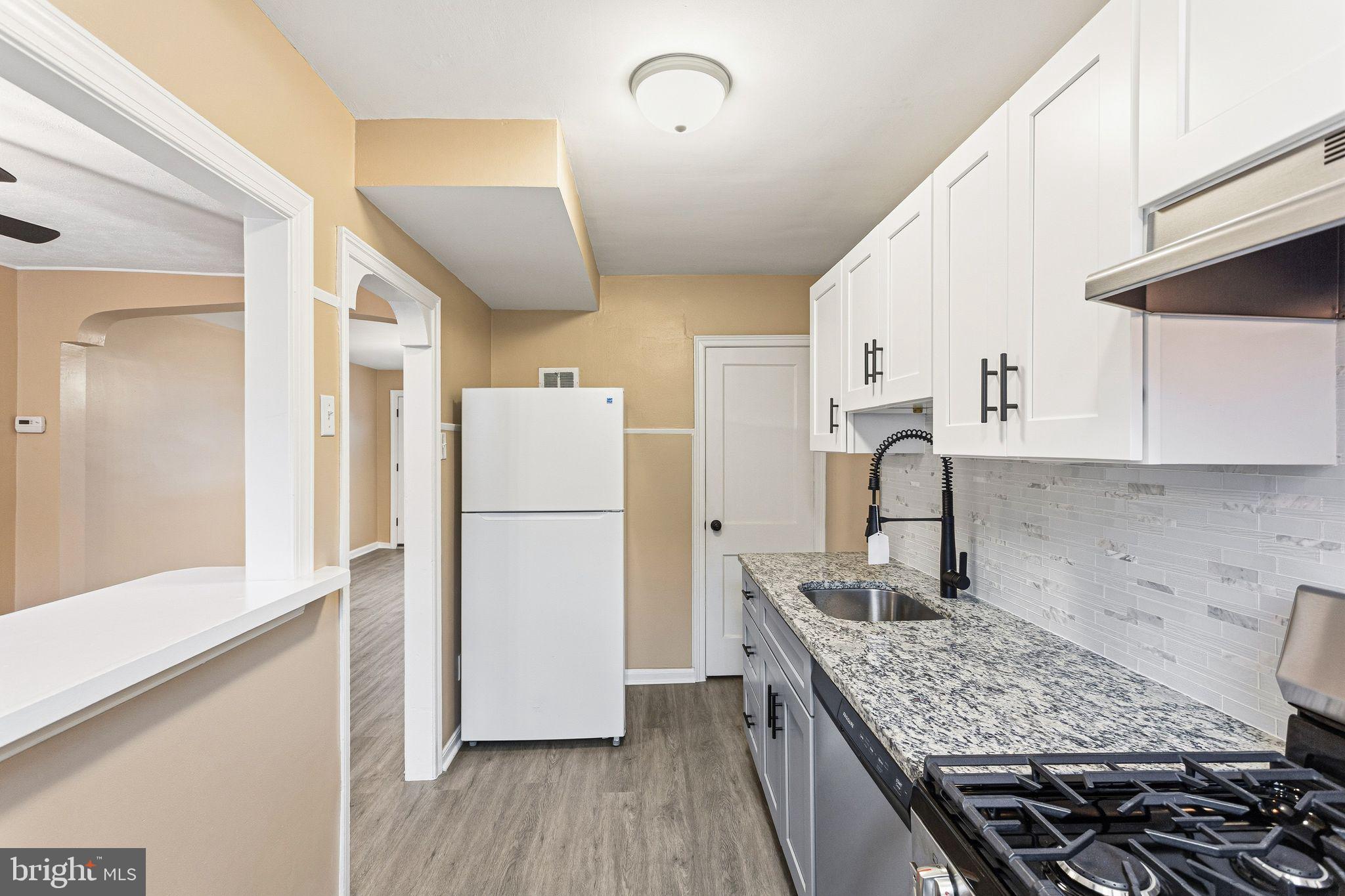 4528 Tudor Street Philadelphia, PA 19136 - Photo 7 of 21 a kitchen with a refrigerator and a sink