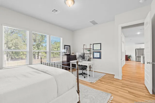 a bedroom with a bed and a table