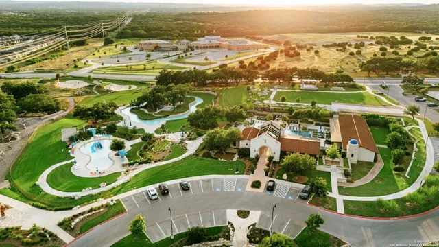 an aerial view of residential house with outdoor space and swimming pool