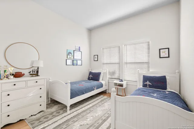 a bedroom with a bed and a dresser