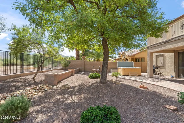 a view of staircase with lots of frames on wall and windows
