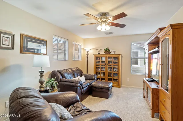a bathroom with a tub a sink double vanity and a mirror