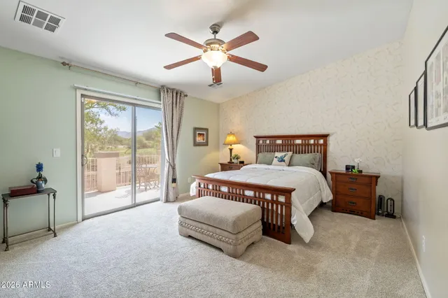 a white bath tub sitting next to a white sink