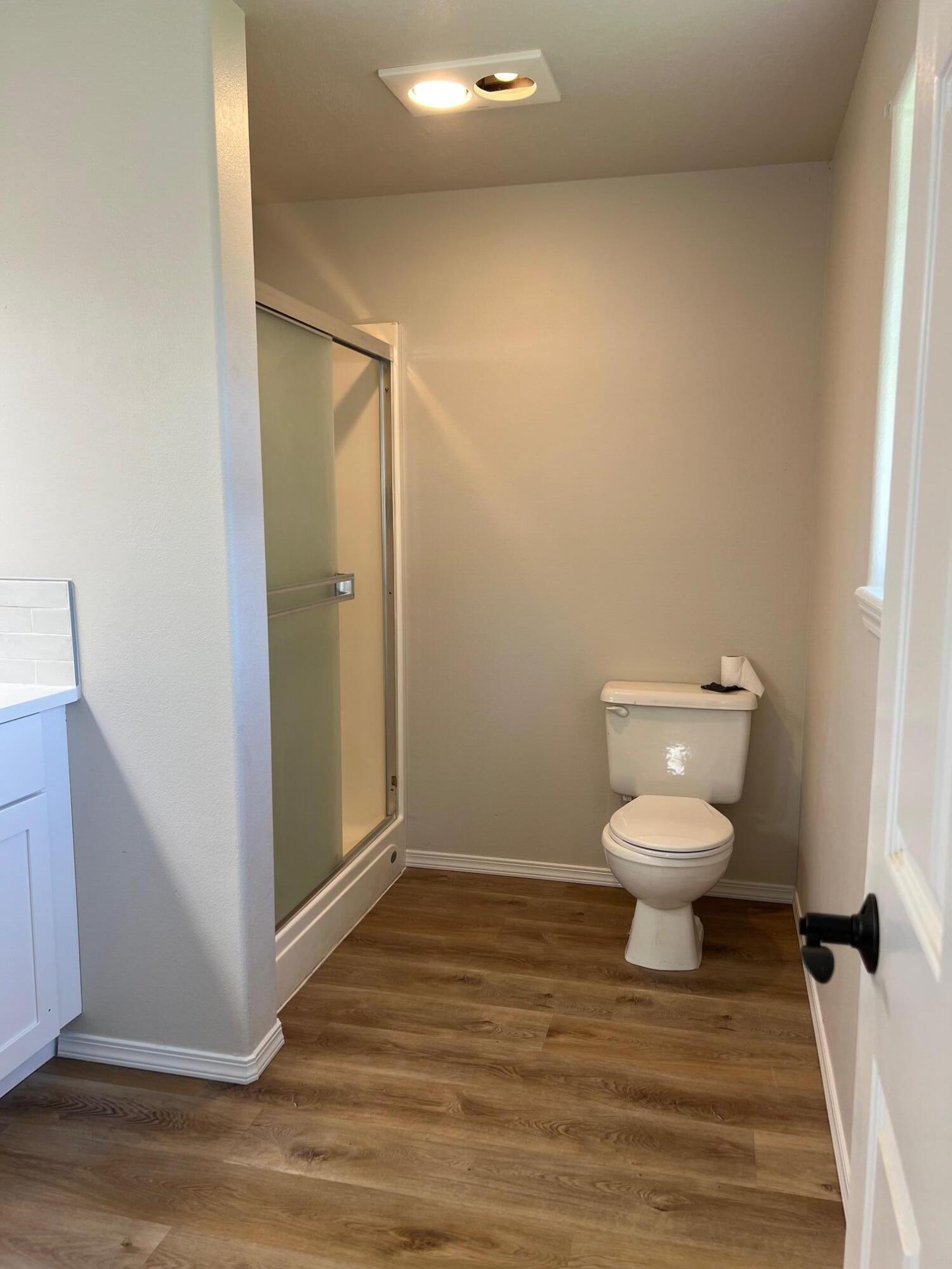 629 Deer Ridge Court Madras, OR 97741 - Photo 25 of 39 a white toilet sitting next to a bathroom sink