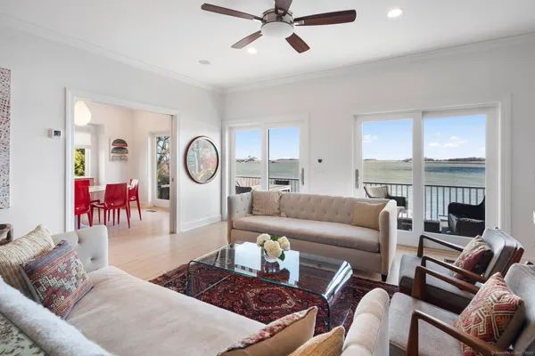 a living room with furniture a fireplace and window