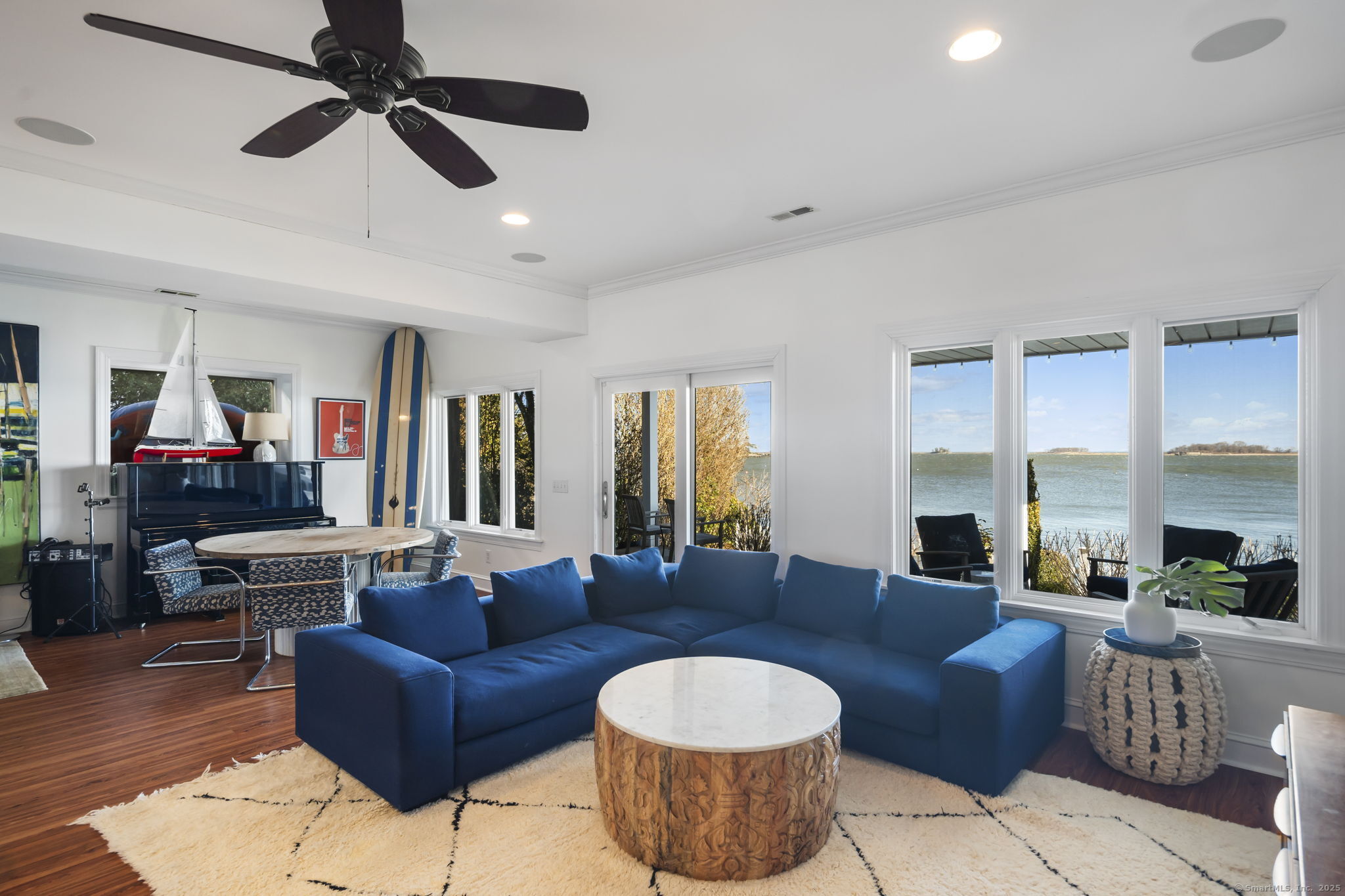 38 Yarmouth Road Norwalk, CT 06853 - Photo 21 of 22 a living room with furniture and a flat screen tv
