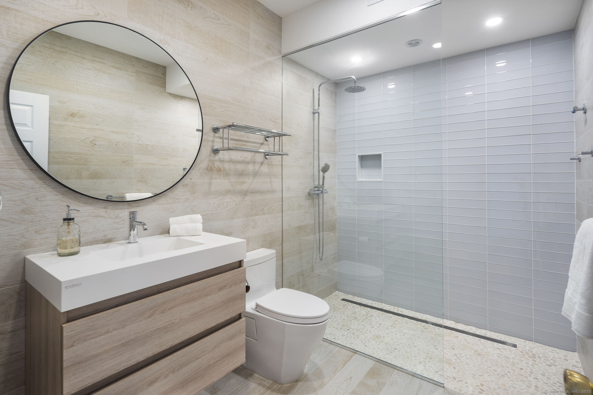 38 Yarmouth Road Norwalk, CT 06853 - Photo 22 of 22 a bathroom with a sink a toilet and a mirror