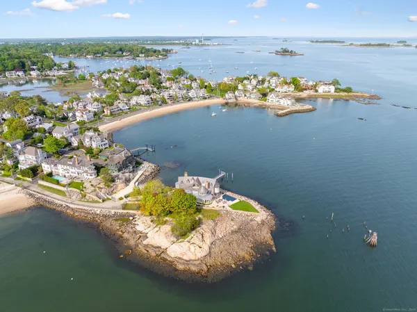 an aerial view of a house with a lake view
