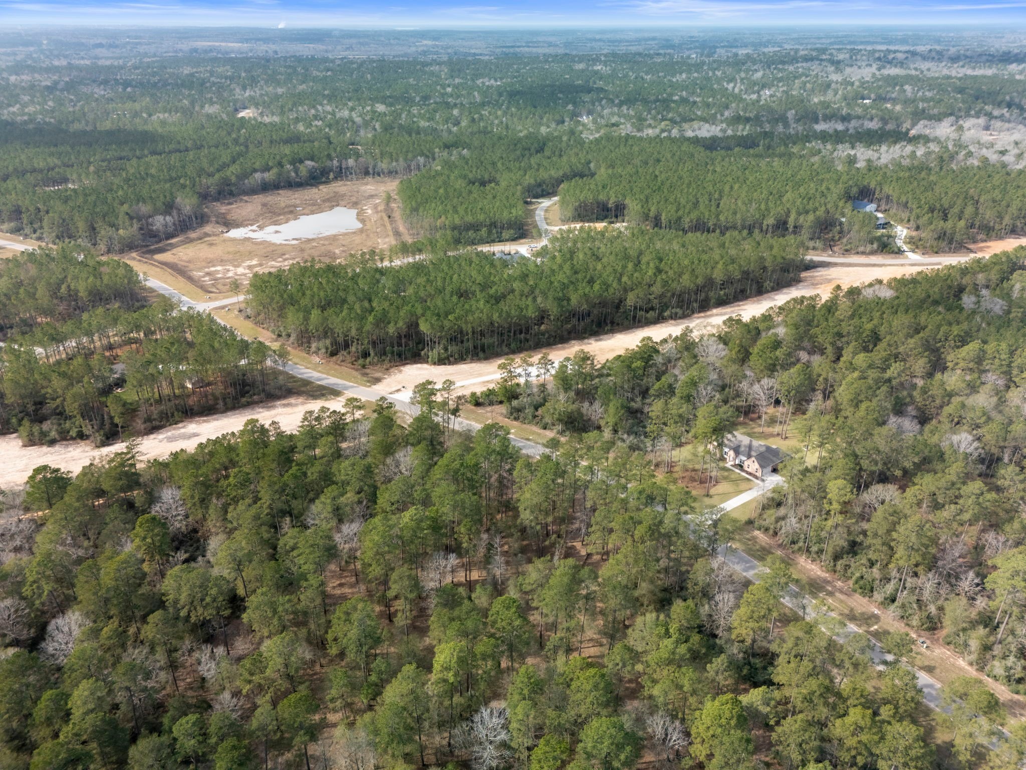 15880 Four Hls Road Willis, TX 77378 - Photo 24 of 25 an aerial view of residential houses with outdoor space and trees