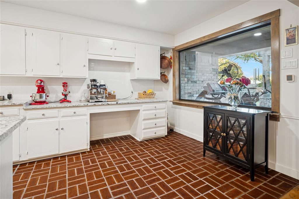 3701 Streamwood Road Fort Worth, TX 76116 - Photo 13 of 34 a kitchen with a cabinets and window