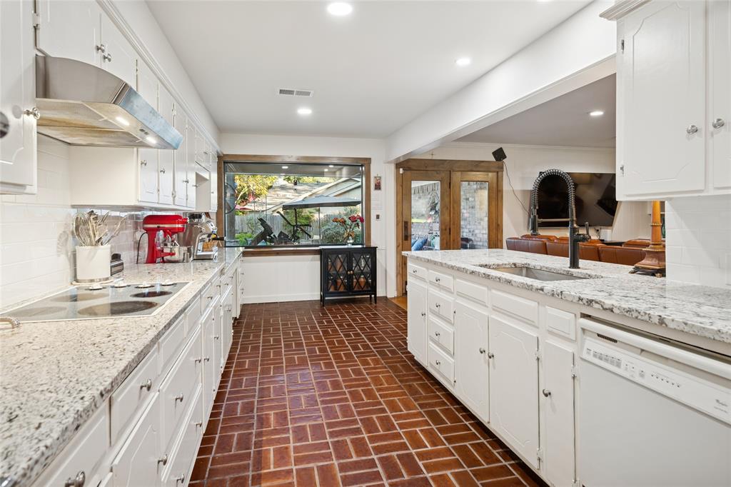 3701 Streamwood Road Fort Worth, TX 76116 - Photo 14 of 34 a large kitchen with stainless steel appliances granite countertop a sink and cabinets