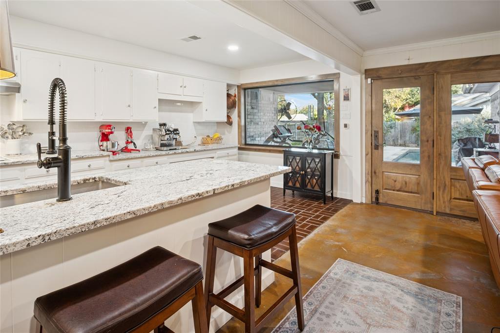 3701 Streamwood Road Fort Worth, TX 76116 - Photo 16 of 34 a view of a kitchen with granite countertop lots of counter top space and furniture