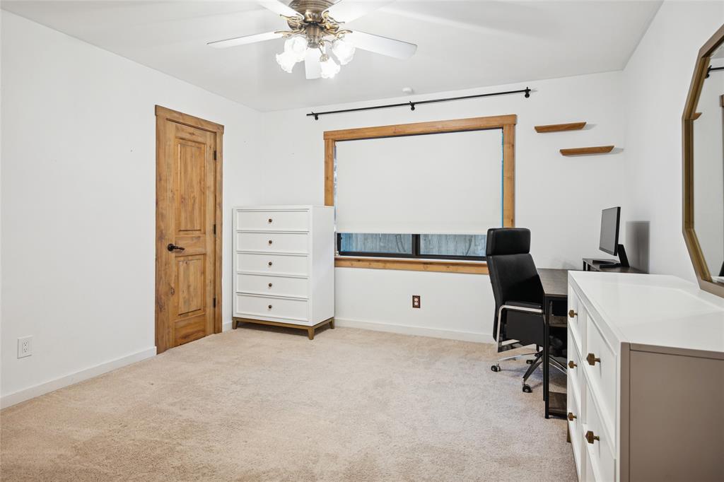 3701 Streamwood Road Fort Worth, TX 76116 - Photo 19 of 34 a view of a workspace with furniture and a window