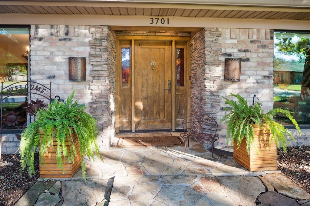 3701 Streamwood Road Fort Worth, TX 76116 - Photo 2 of 34 a couple of potted plants in front of door