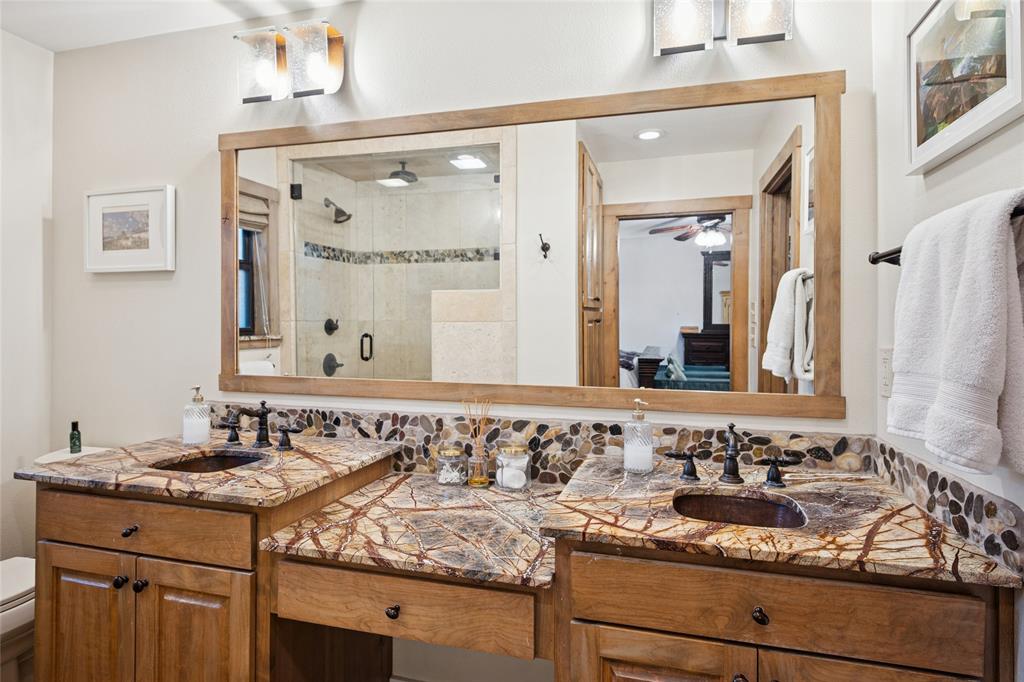 3701 Streamwood Road Fort Worth, TX 76116 - Photo 25 of 34 a bathroom with a granite countertop sink and a mirror