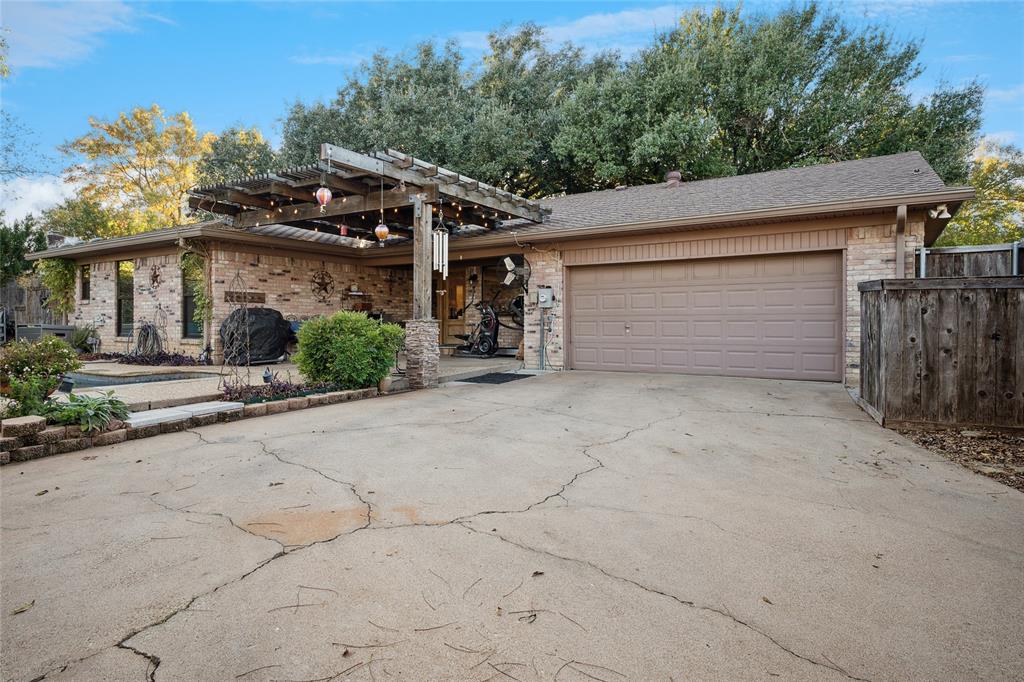3701 Streamwood Road Fort Worth, TX 76116 - Photo 33 of 34 front view of a house with a street