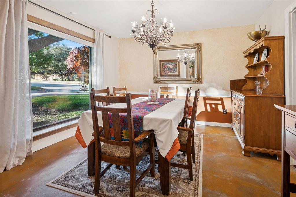 3701 Streamwood Road Fort Worth, TX 76116 - Photo 5 of 34 a view of a dining room with furniture and chandelier