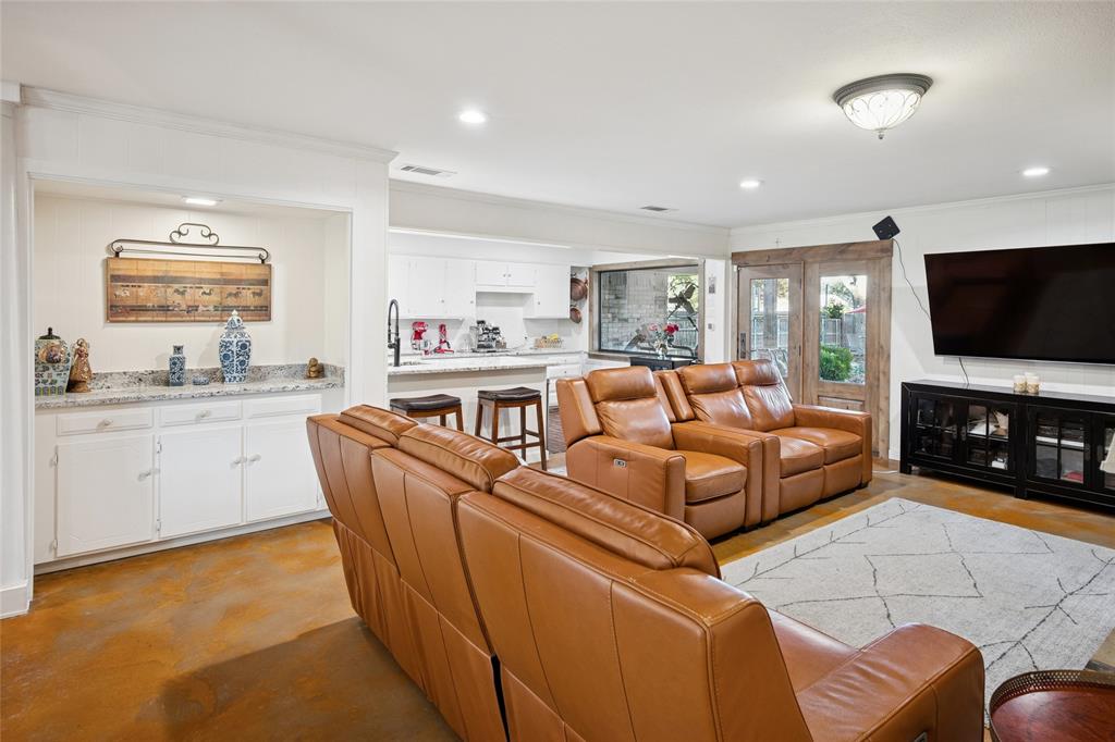 3701 Streamwood Road Fort Worth, TX 76116 - Photo 9 of 34 a living room with furniture and a flat screen tv