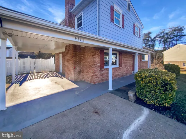 a view of a house with a snow in a yard