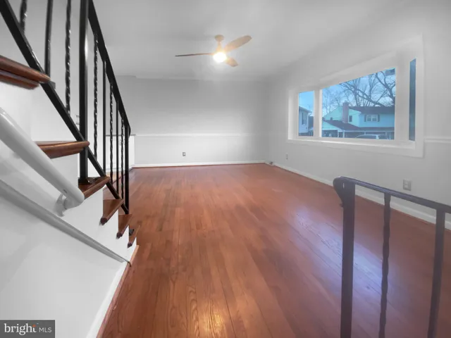 a view of an entryway with wooden floor