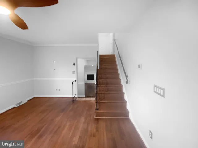 a view of entryway with wooden floor