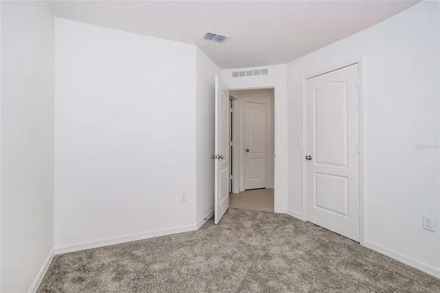 a view of a room that has a window in it