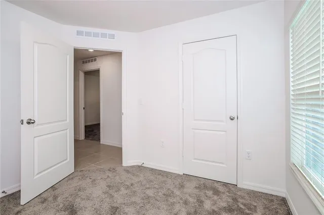 a view of hallway with closet