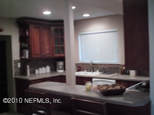 10514 Rutgers Road Jacksonville, FL 32218 - Photo 8 of 21 a kitchen with a sink and a window