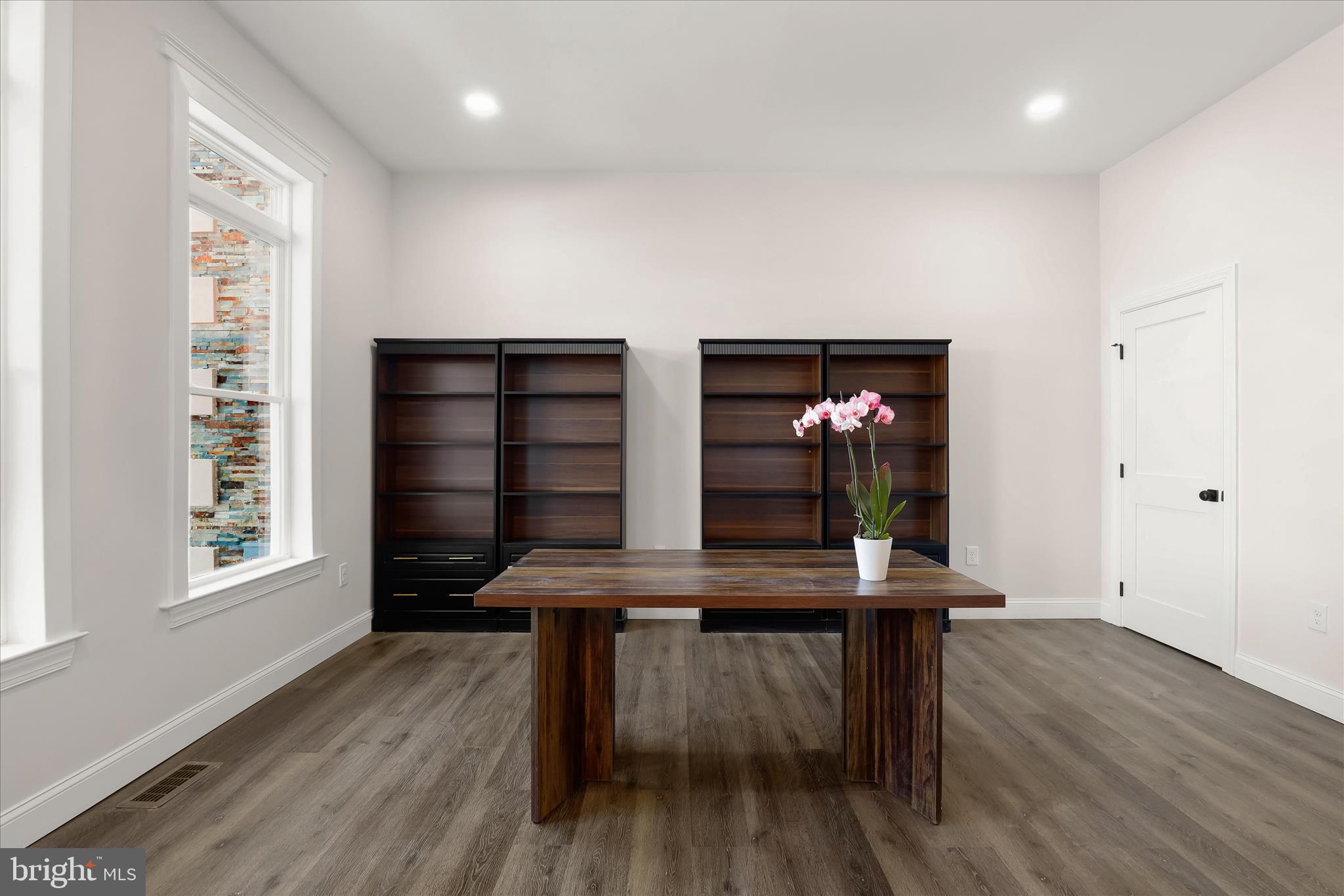 5004 Ten Oaks Road Dayton, MD 21036 - Photo 43 of 99 a view of a workspace with furniture and wooden floor