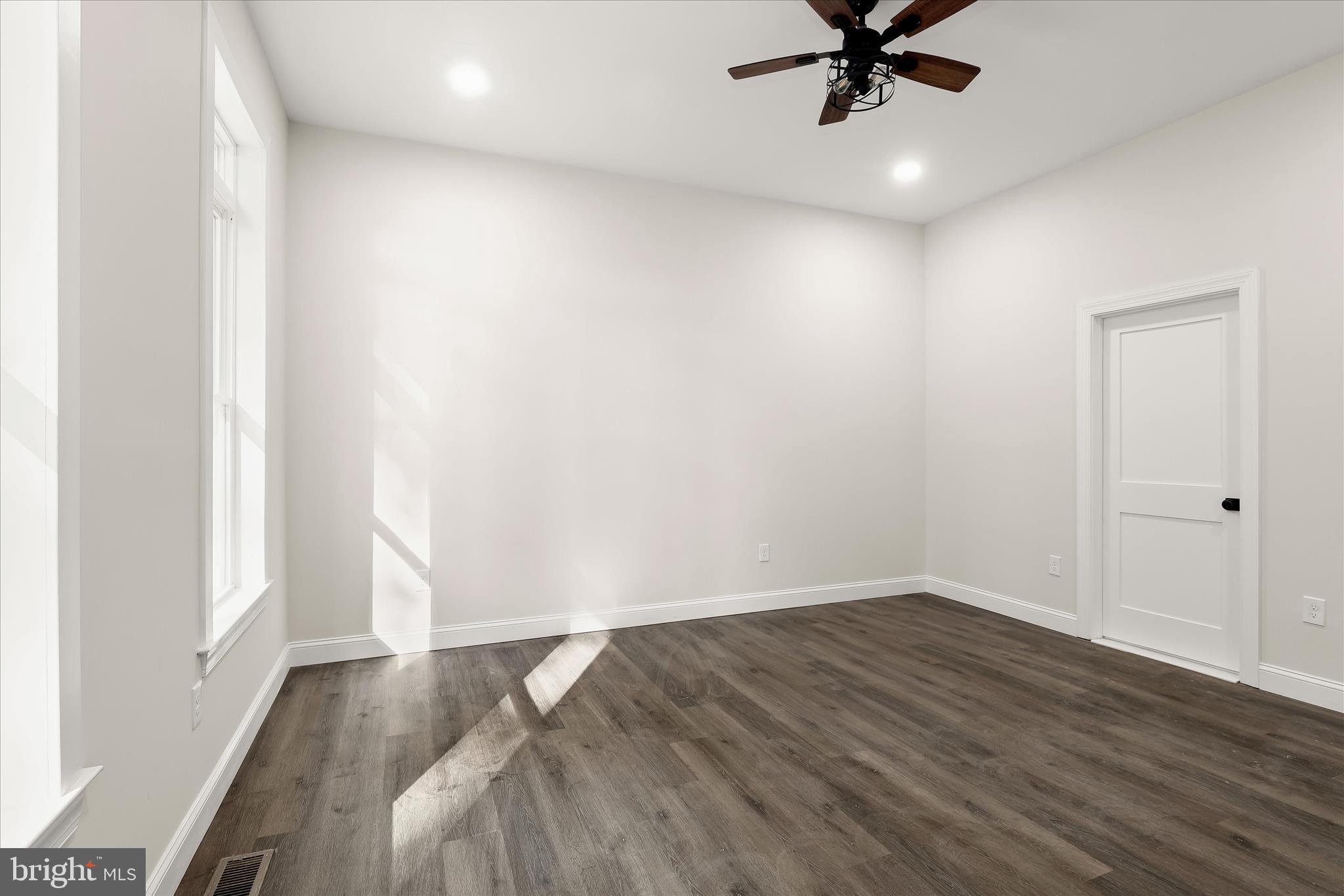 5004 Ten Oaks Road Dayton, MD 21036 - Photo 48 of 99 an empty room with wooden floor fan and windows