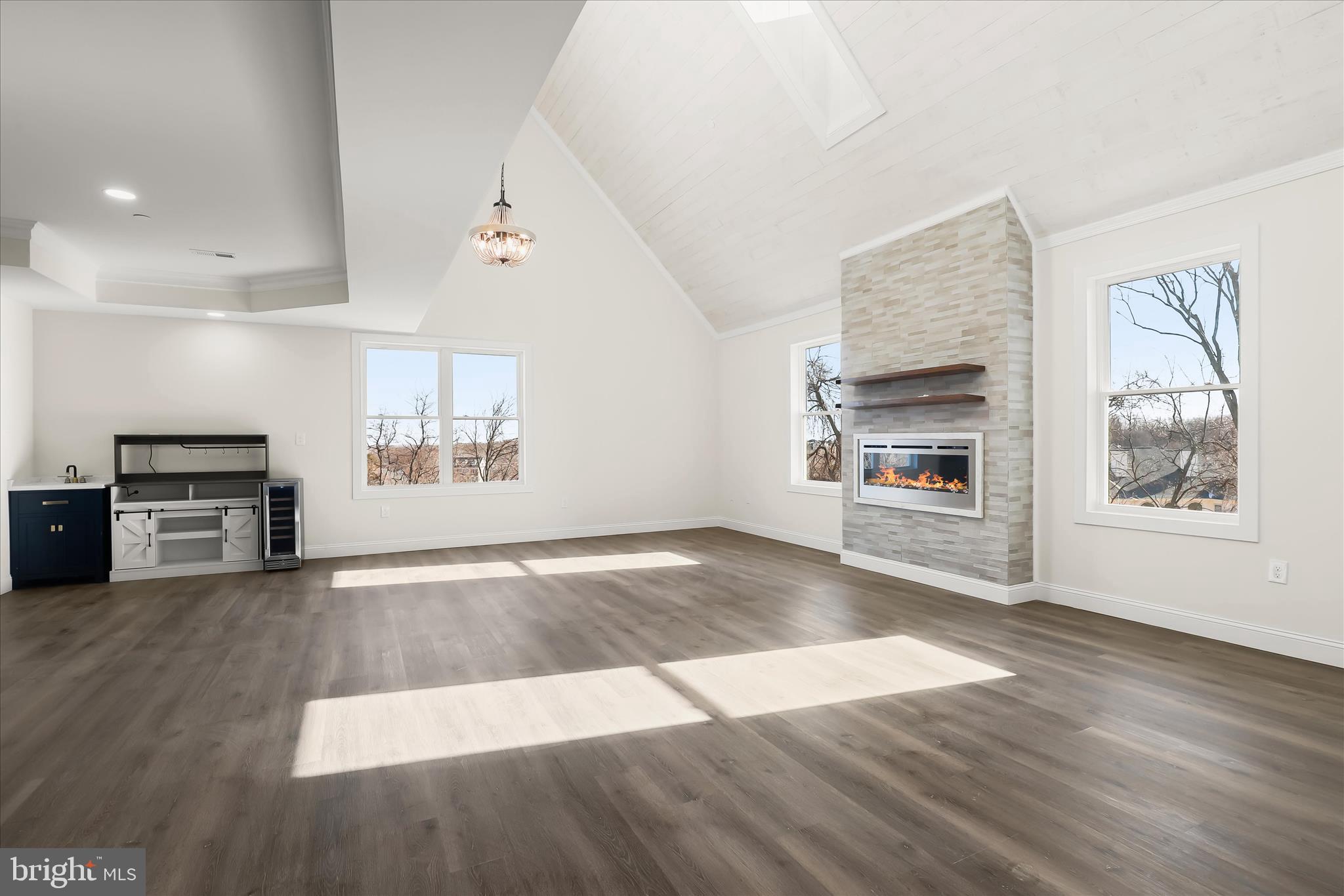 5004 Ten Oaks Road Dayton, MD 21036 - Photo 52 of 99 an empty room with wooden floor kitchen view and windows