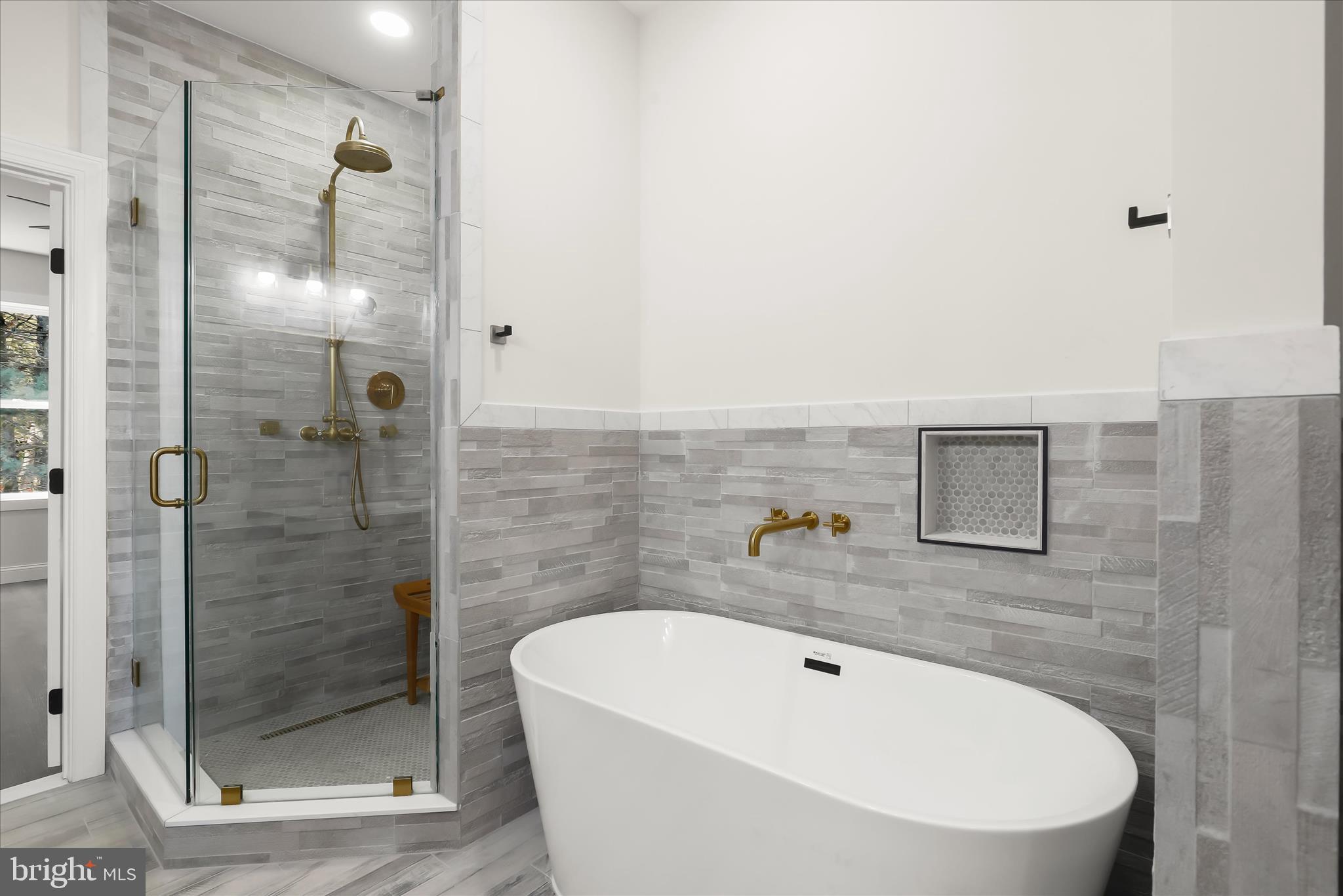 5004 Ten Oaks Road Dayton, MD 21036 - Photo 64 of 99 a bathroom with a white bath tub sitting next to a shower