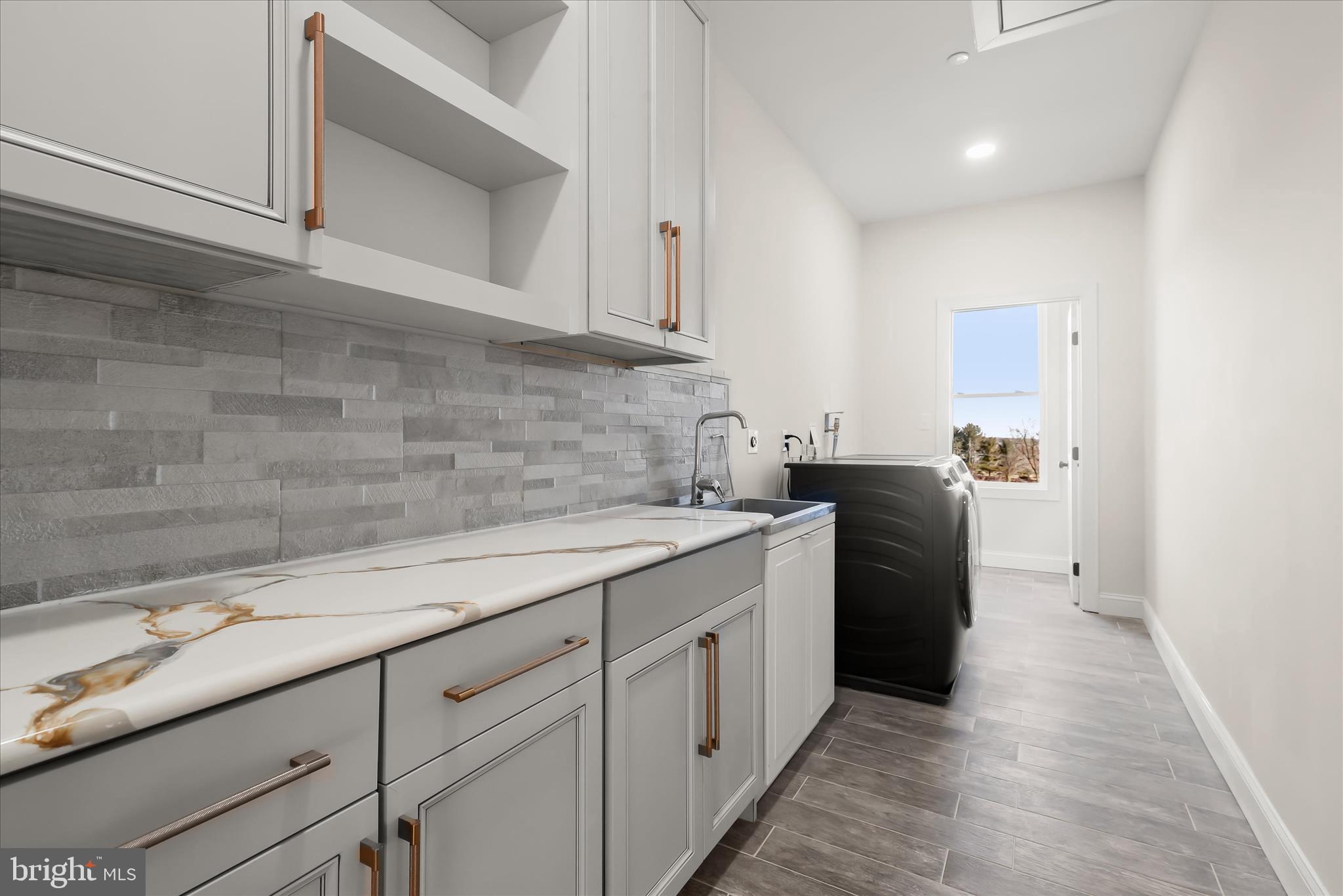 5004 Ten Oaks Road Dayton, MD 21036 - Photo 71 of 99 a utility room with cabinets
