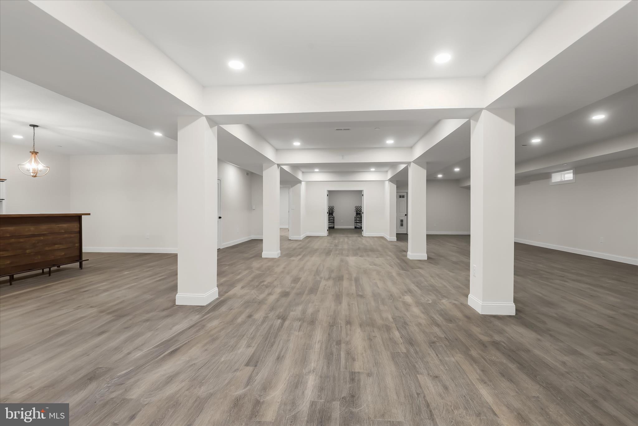 5004 Ten Oaks Road Dayton, MD 21036 - Photo 82 of 99 a view of an empty room with wooden floor