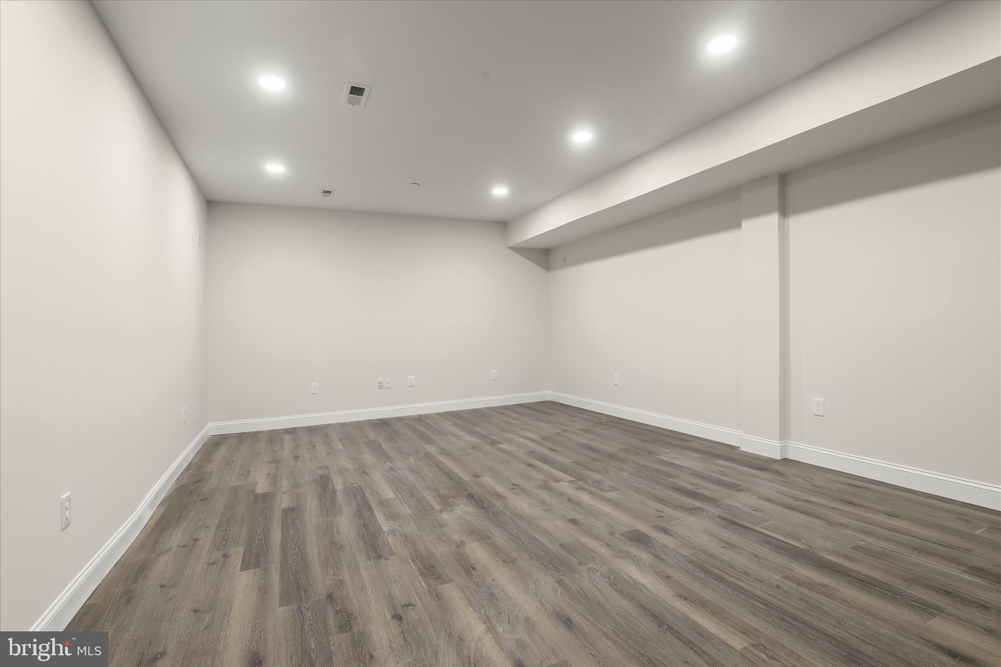 5004 Ten Oaks Road Dayton, MD 21036 - Photo 88 of 99 an empty room with wooden floor and windows