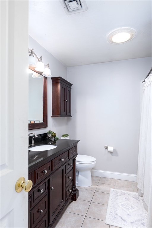 27 Vista Circle Rutland, MA 01543 - Photo 21 of 35 a bathroom with a sink a toilet and mirror