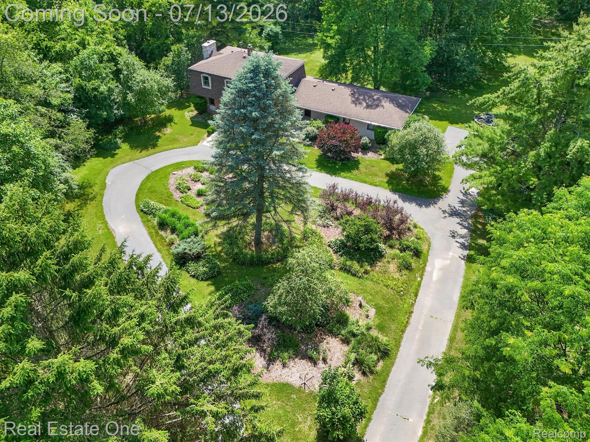 6039 Fish Lake Road Holly, MI 48442 - Photo 63 of 70 Beautiful Circular driveway with gardens throughout!