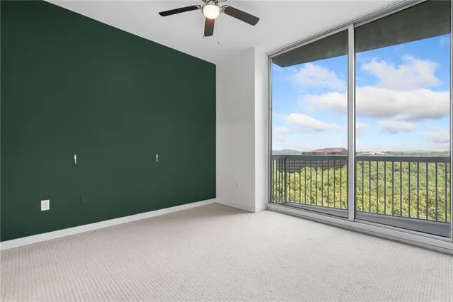 a view of an empty room with a sliding door