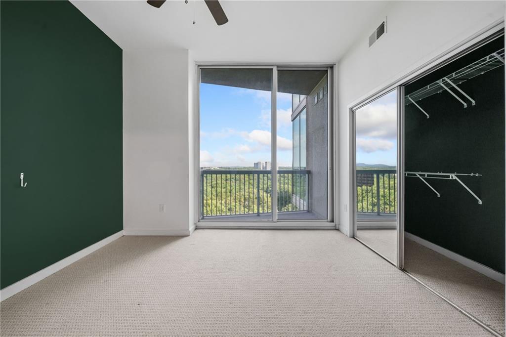 3300 Windy Ridge Parkway Southeast, Unit 1113 Atlanta, GA 30339 - Photo 17 of 39 a view of an empty room with a sliding door