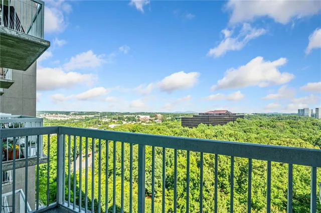 a view of a backyard with swimming pool and furniture