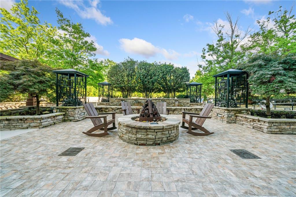 3300 Windy Ridge Parkway Southeast, Unit 1113 Atlanta, GA 30339 - Photo 25 of 39 a view of a backyard with swimming pool and furniture