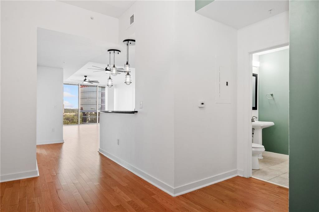 3300 Windy Ridge Parkway Southeast, Unit 1113 Atlanta, GA 30339 - Photo 3 of 39 a view of a hallway with wooden floor